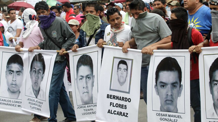 People march in protest in Acapulco, Guerrero state, on October 17, 2014.