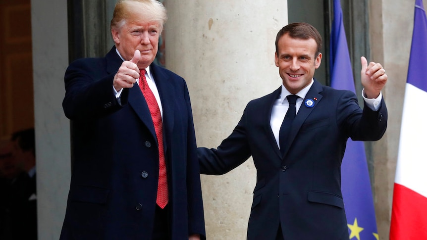 French President Emmanuel Macron (right) and US President Donald Trump thumb up at the Elysee Palace in Paris.