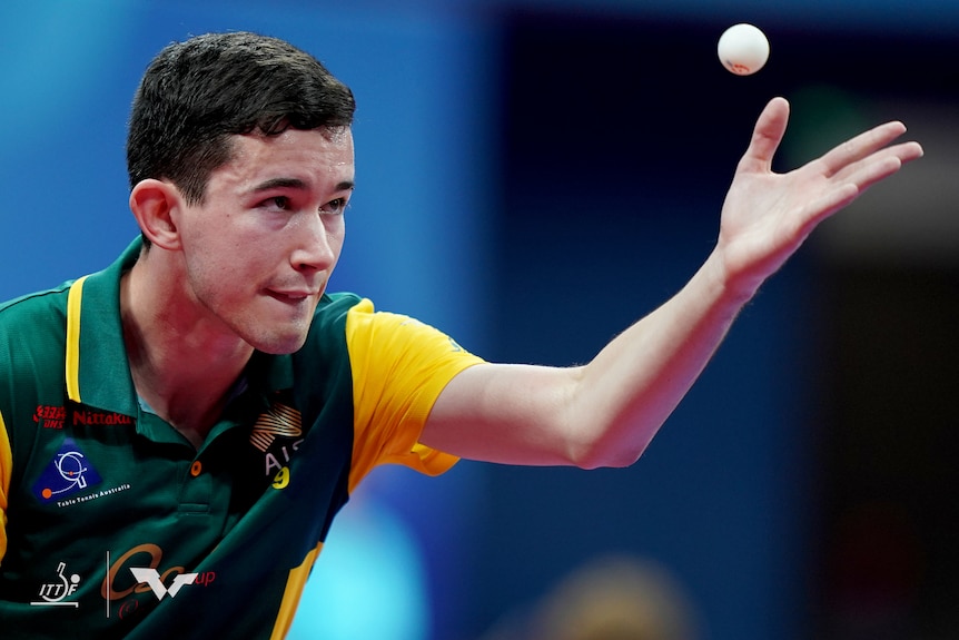Dillon Chambers looks at a table tennis ball that he throws up with his hand