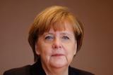 Angela Merkel looks straight ahead.
