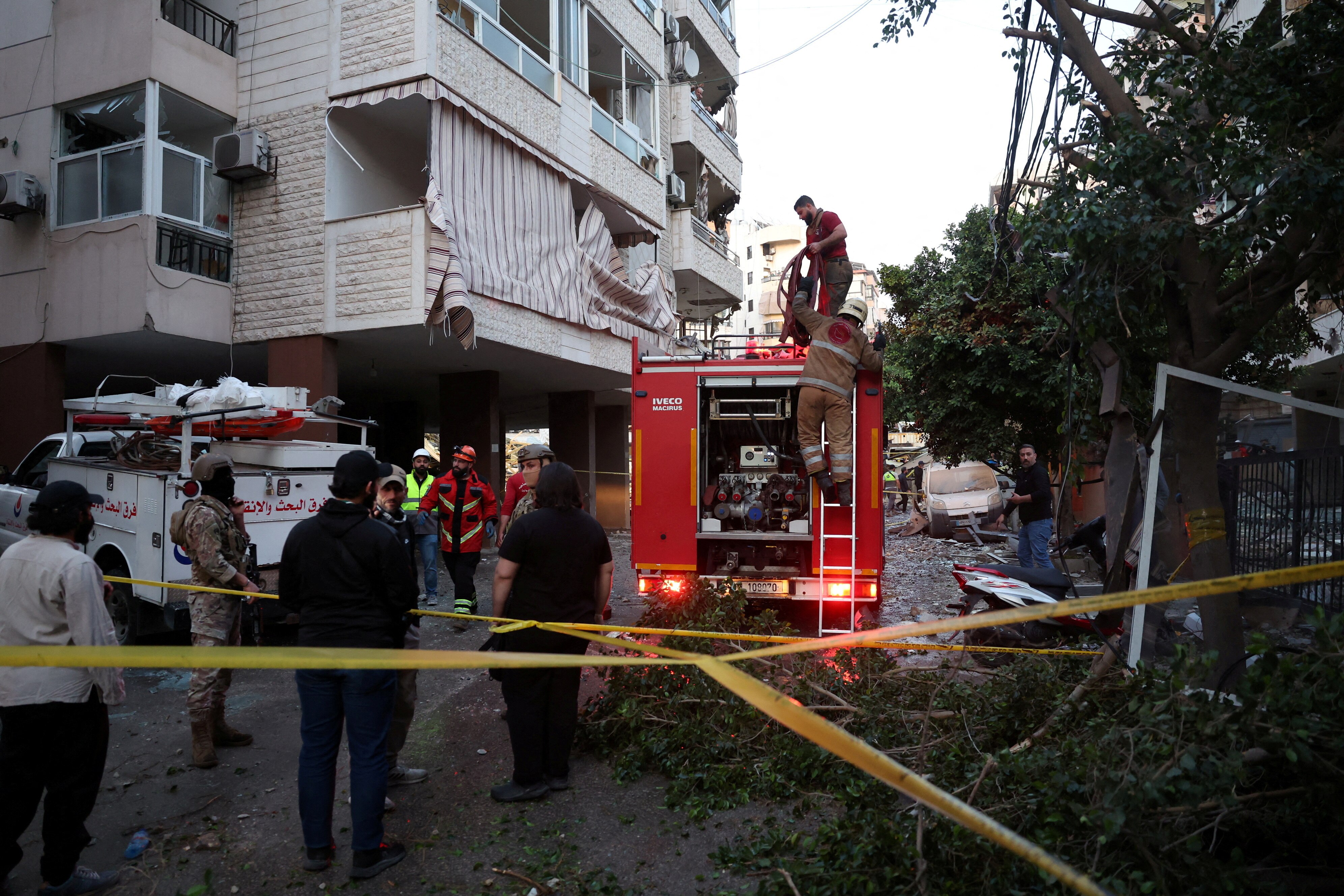 A fire truck on a partially bombed out residential street in Beirut.