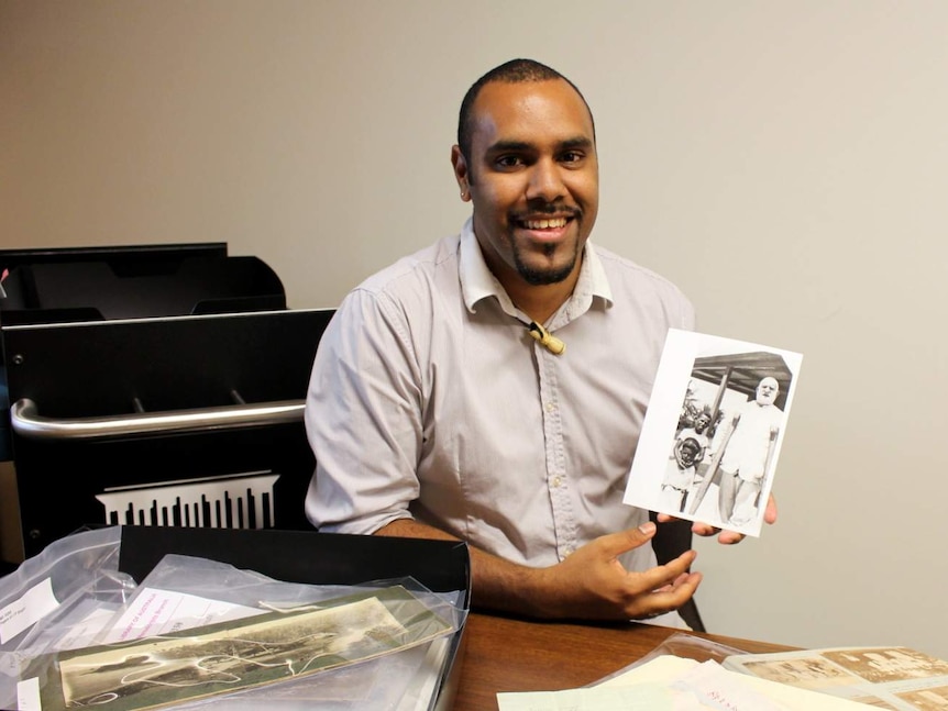 John Morseu with National Library items about the Torres Strait.