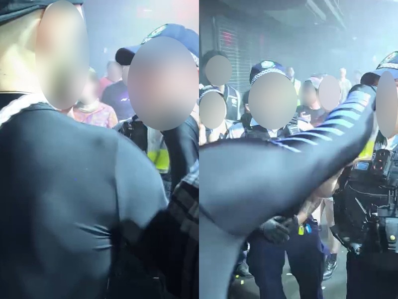 nsw police officers inside a night club talking to a man