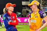Meg Lanning of the Delhi Capitals speaks to Tahlia McGrath of the UP Warriorz after a Women's Premier League Twenty20 match.