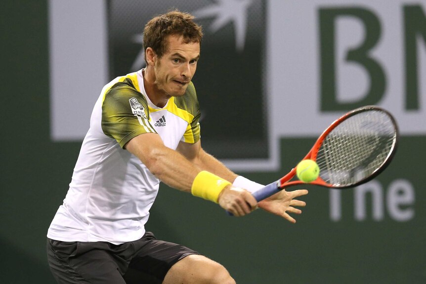 Scottish player Andy Murray hits a return to Lu Yen-Hsen of Taiwan at Indian Wells.