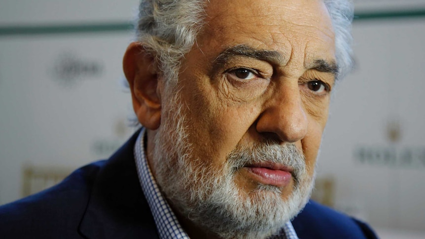 Placido Domingo looks directly to the camera.