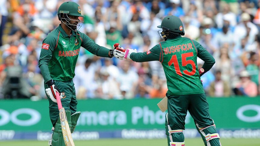Bangladesh's Tamim Iqbal, (L), and Mushfiqur Rahim celebrate against India at the Champions Trophy.