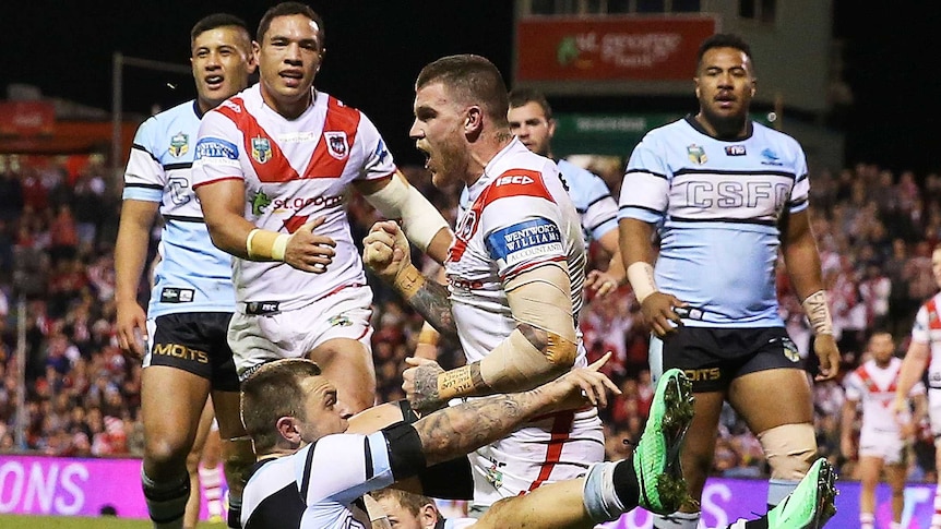 Josh Dugan celebrates a try for the Dragons