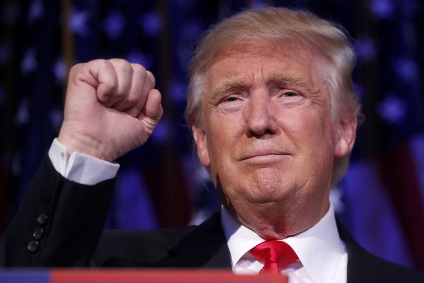 Republican US presidential nominee Donald Trump pumps his fist