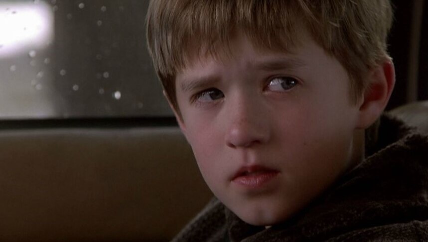 Haley Joel Osment looks out of the corner of his eyes
