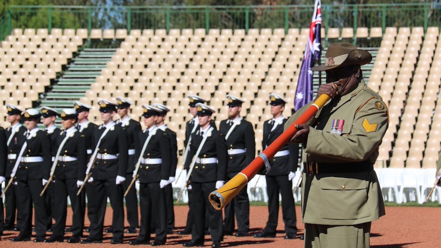 Sergeant Norman Daymirringu plays the didgeridoo at the Anzac Day 2016 national ceremony.