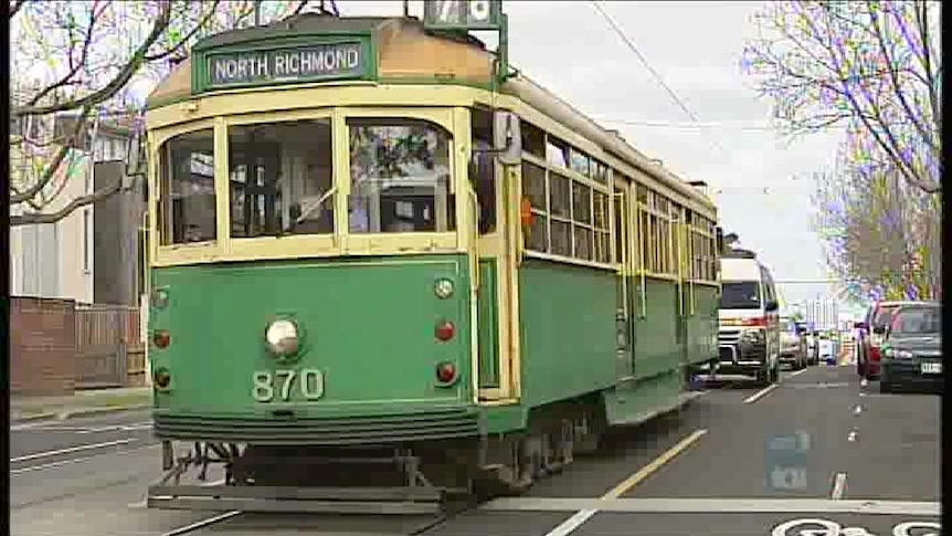 Green and yellow W-class tram in Melbourne