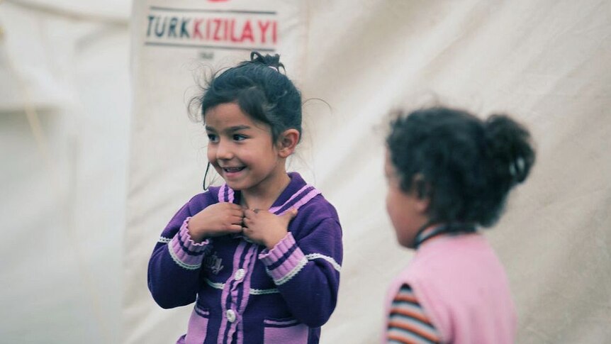 Children laugh in a Turkish tent city