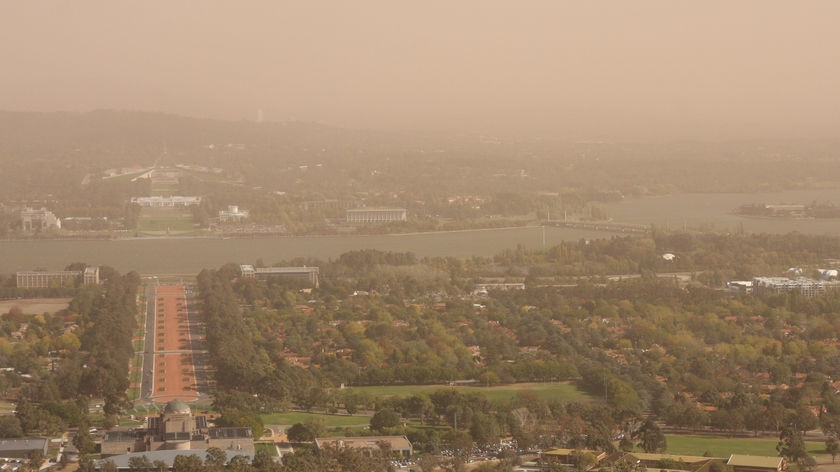 A dust storm rolls in to cover central Canberra