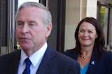 WA Premier Colin Barnett, blurred in foreground, with Deputy Premier Liza Harvey behind.