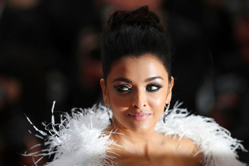 Aishwarya Rai Bachchan poses for photographers upon arrival at the premiere of the film 'La Belle Epoque' in Cannes.