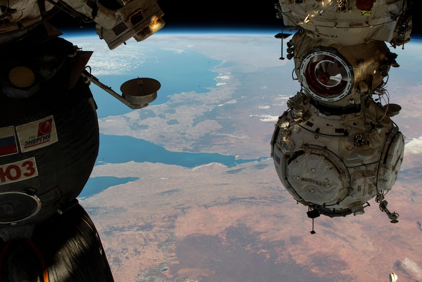 South Australia is pictured from space, with parts of the docking modules from ISS seen on the sides.
