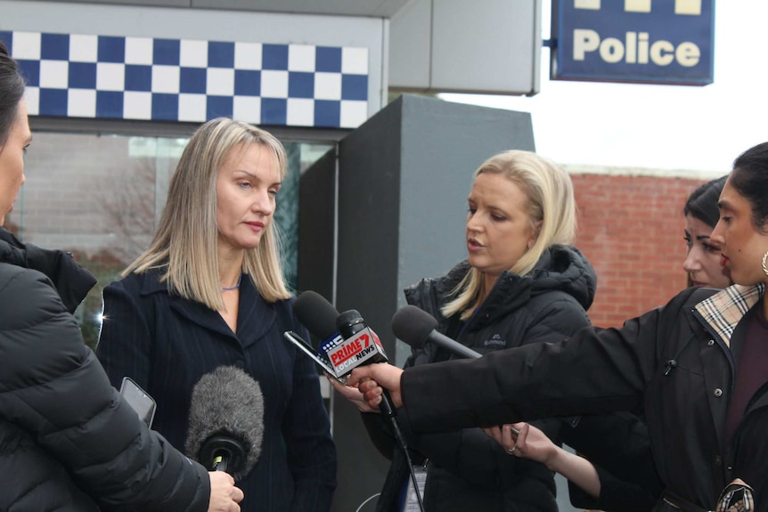 Dr Lara Roseke from the Royal Australian College of General Practitioners addresses media outside a police station.