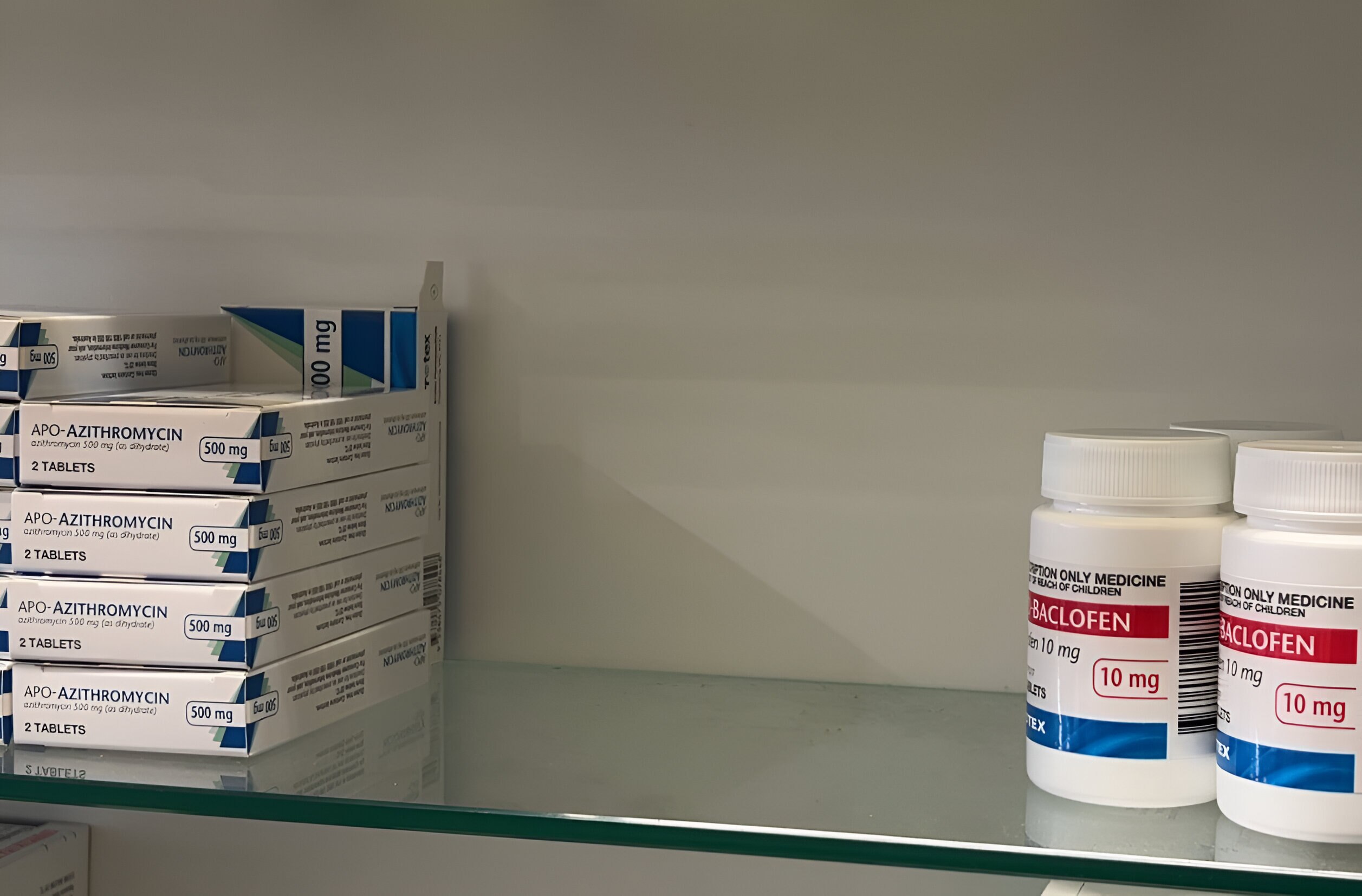 A gap between medications on a shelf.