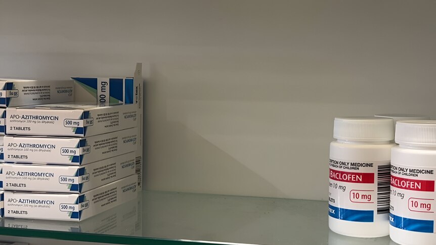 A shelf of different medications with an empty space at centre