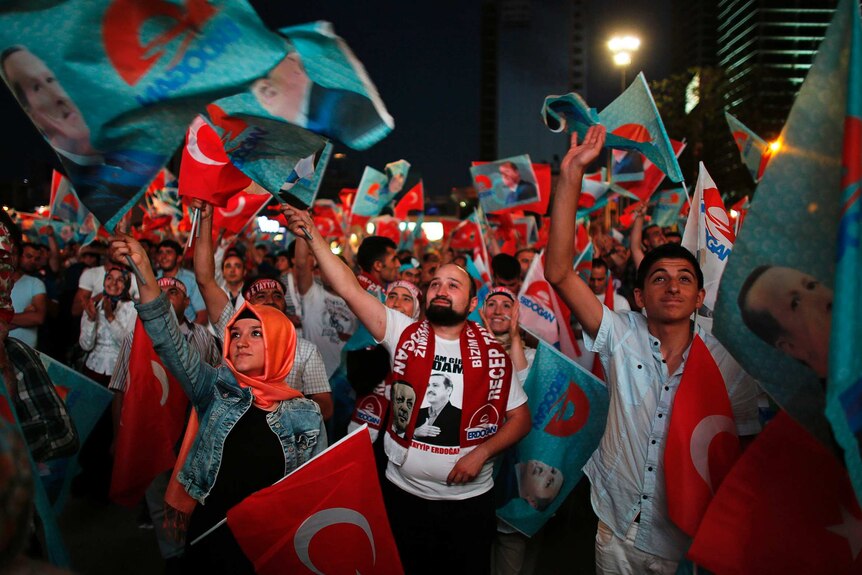 Supporters of Turkish Prime Minister Tayyip Erdogan celebrate