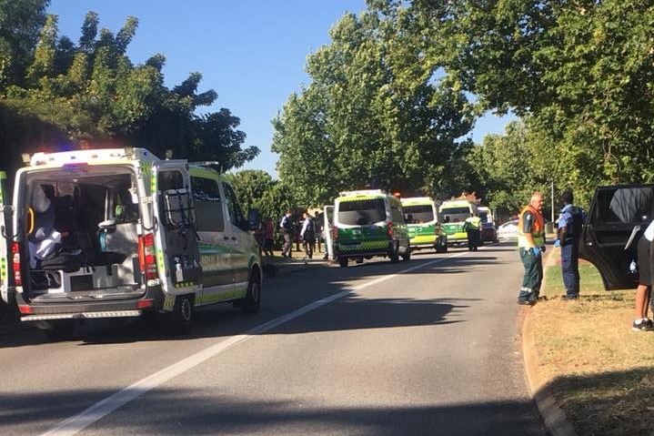 A row of ambulances in Canning Vale, where pedestrians are believed to have been hit.