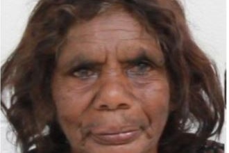 close up of woman's face, Indigenous, brown eyes, dark hair