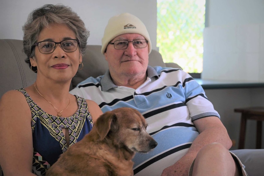 woman, man and dog on a couch