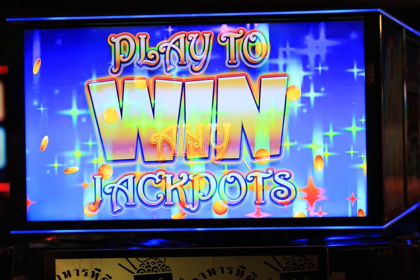 An electronic poker machine screen that says in colourful letters 'Play to win jackpots'.