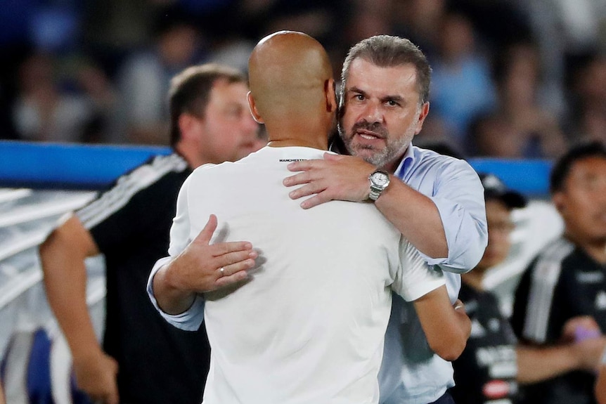 Ange Postecoglou hugs Pep Guardiola.