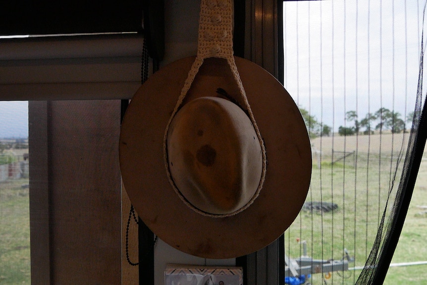 hat hanging on wall