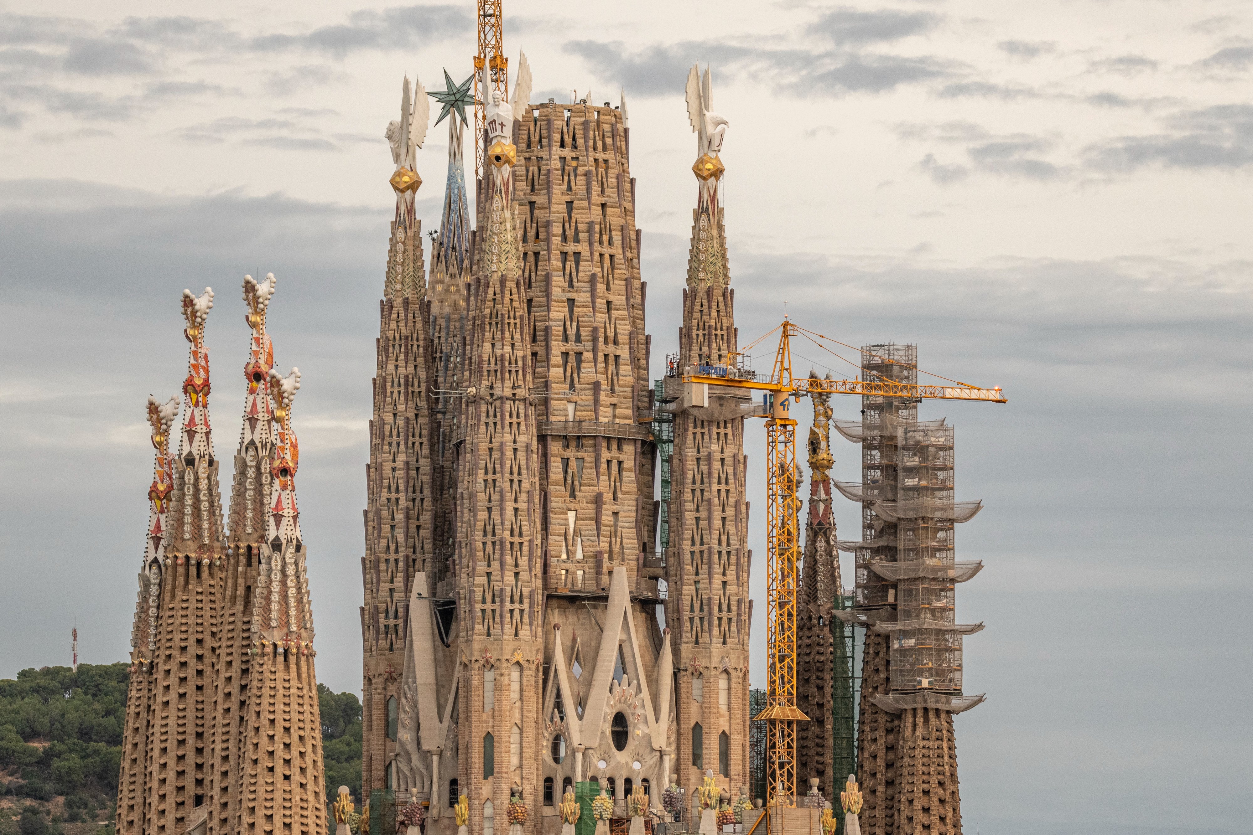 La Sagrada Familia in Barcelona with a crane near one of the towers