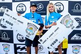 Rio Waida and Zoe Steyn with their winners cheques at the Ballito Pro in South Africa