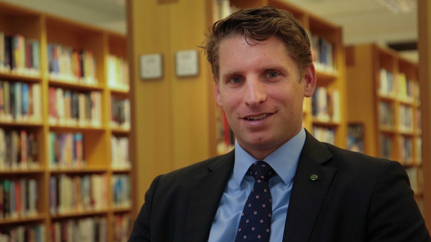 Liberal MP Andrew Hastie in the Members' Reading Room section of the library at Parliament House.