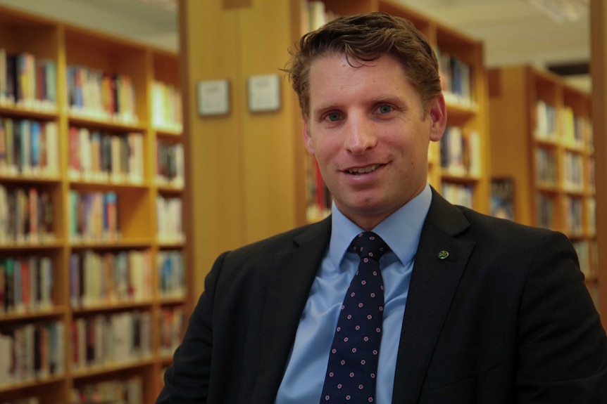 Liberal MP Andrew Hastie in the Members' Reading Room section of the library at Parliament House.