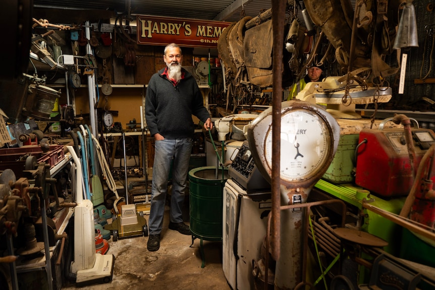 man in old shed of special junk 