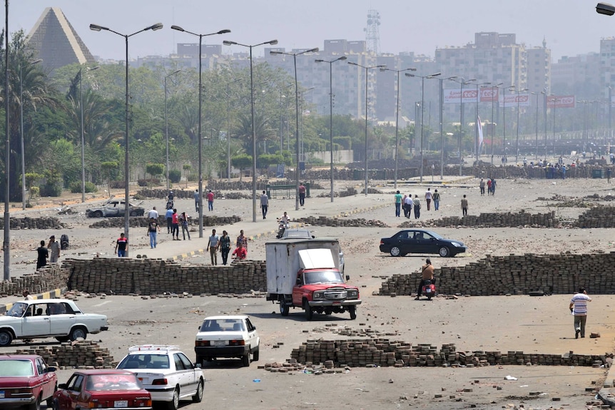 Brick barricades erected along Nasr City's main street as Morsi supporters continue sit-ins.