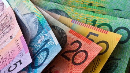 Close-up of Australia's five, 10, 20, 50 and 100 dollar bills.