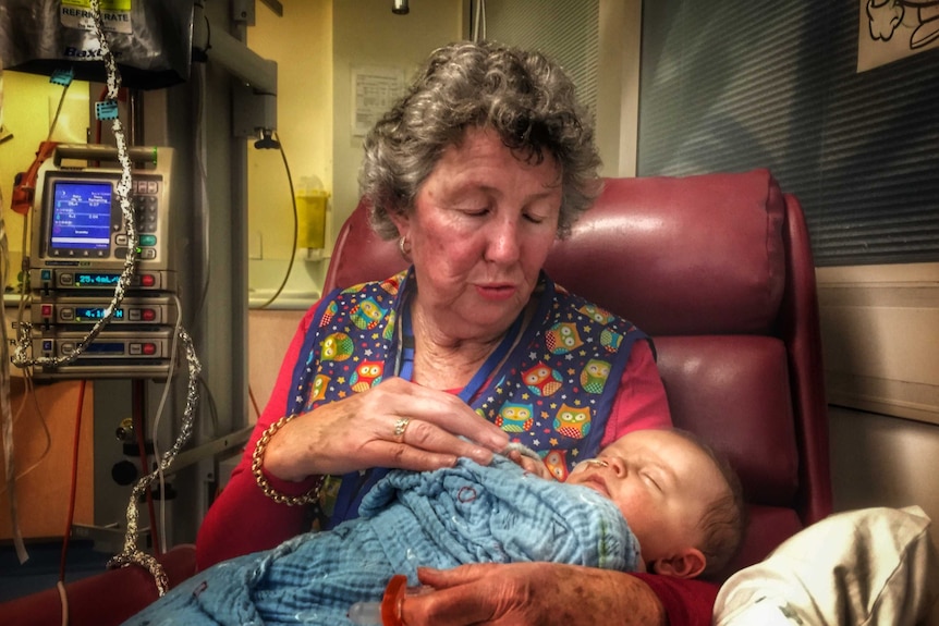 Volunteer Judy Stove with baby Declyn Triffitt.