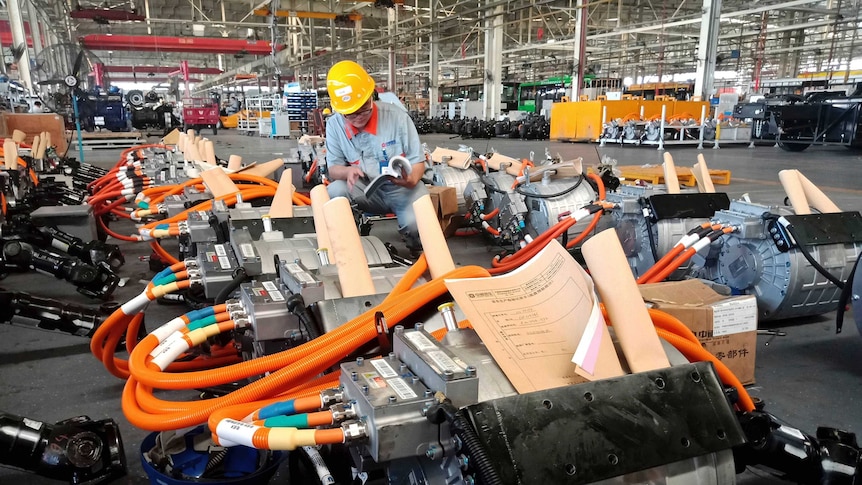 A man works in an auto parts factory in Liaocheng in eastern China