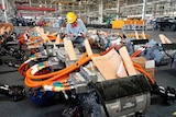 A man works in an auto parts factory in Liaocheng in eastern China