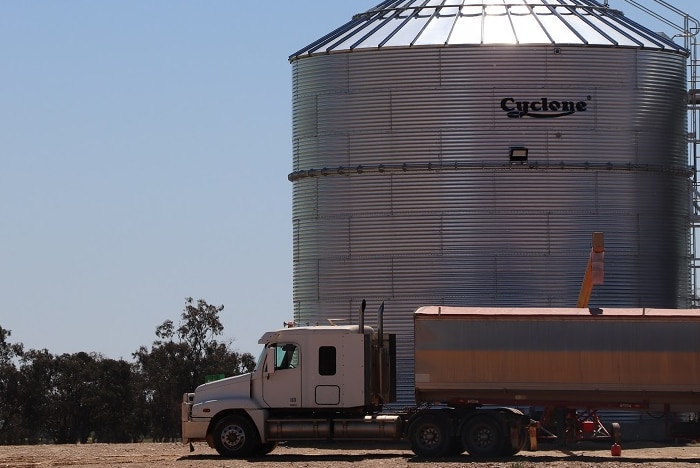 Grain delivery truck and silo