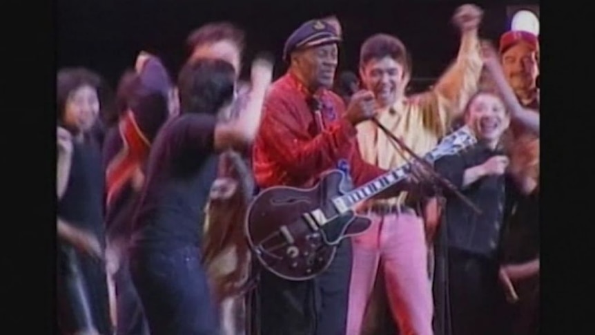 Chuck Berry performs in Tokyo, Japan in 2002, as the audience storms the stage.
