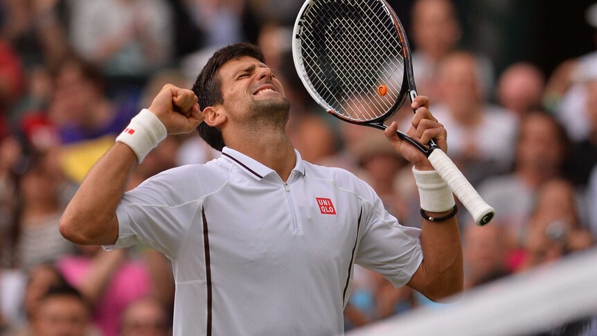 Novak Djokovic celebrates reaching the semi-finals at Wimbledon