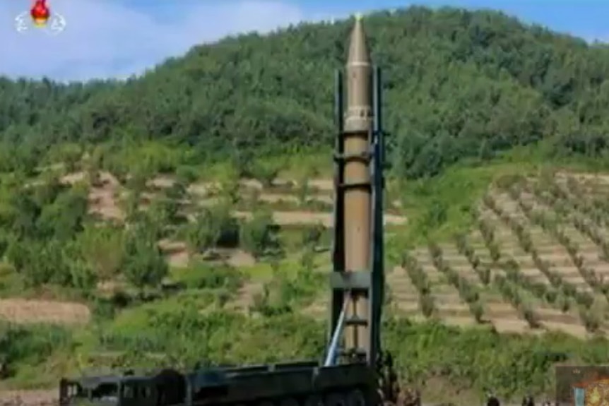 People setting up the Hwasong-14 ICBM before its launch in North Korea.