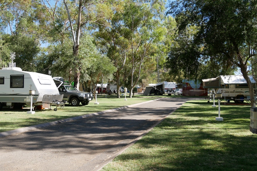 A caravan park with plenty of visitors.