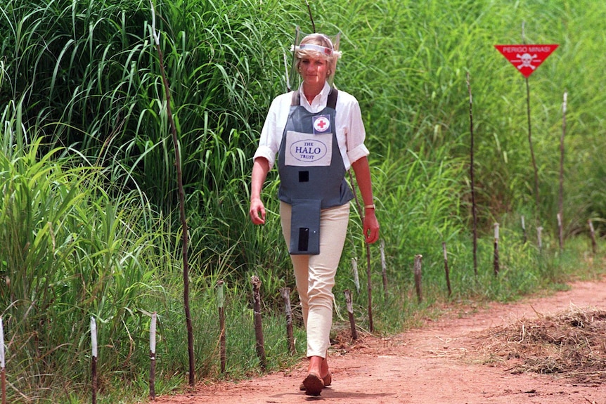 Princess Diana, wearing a bombproof visor, visits a minefield in Huambo, in Angola