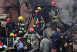 First responders work amid debris from the crashed fighter jet, in Tabriz, Iran 