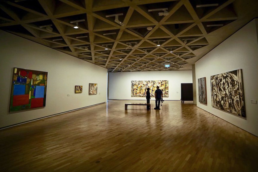 Blue Poles hanging in the National Gallery of Australia