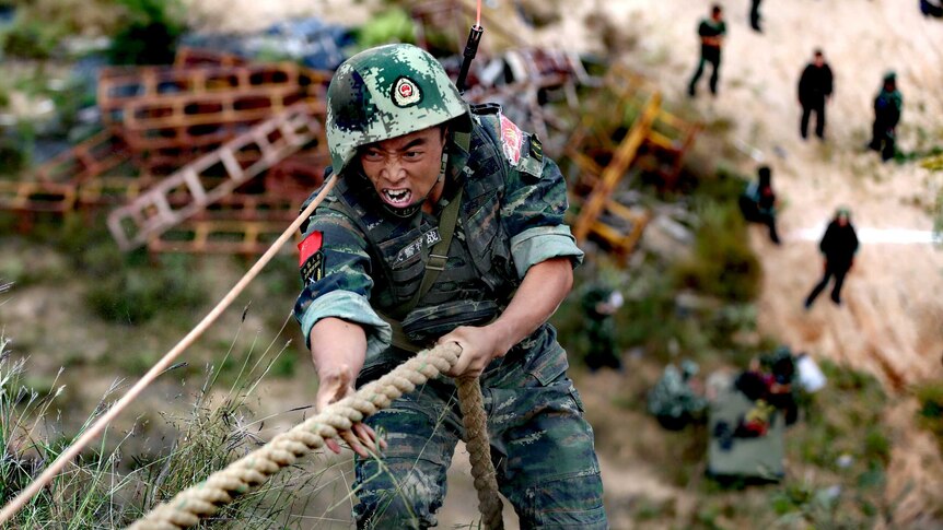 A Chinese paramilitary policeman takes part in a military training session in Xinzhou.